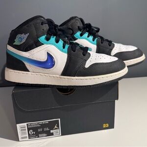Air Jordan Black and White Sneakers with Blue Swoosh